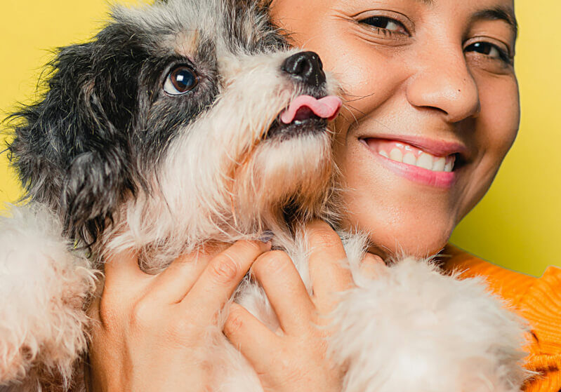 child-holding-dog